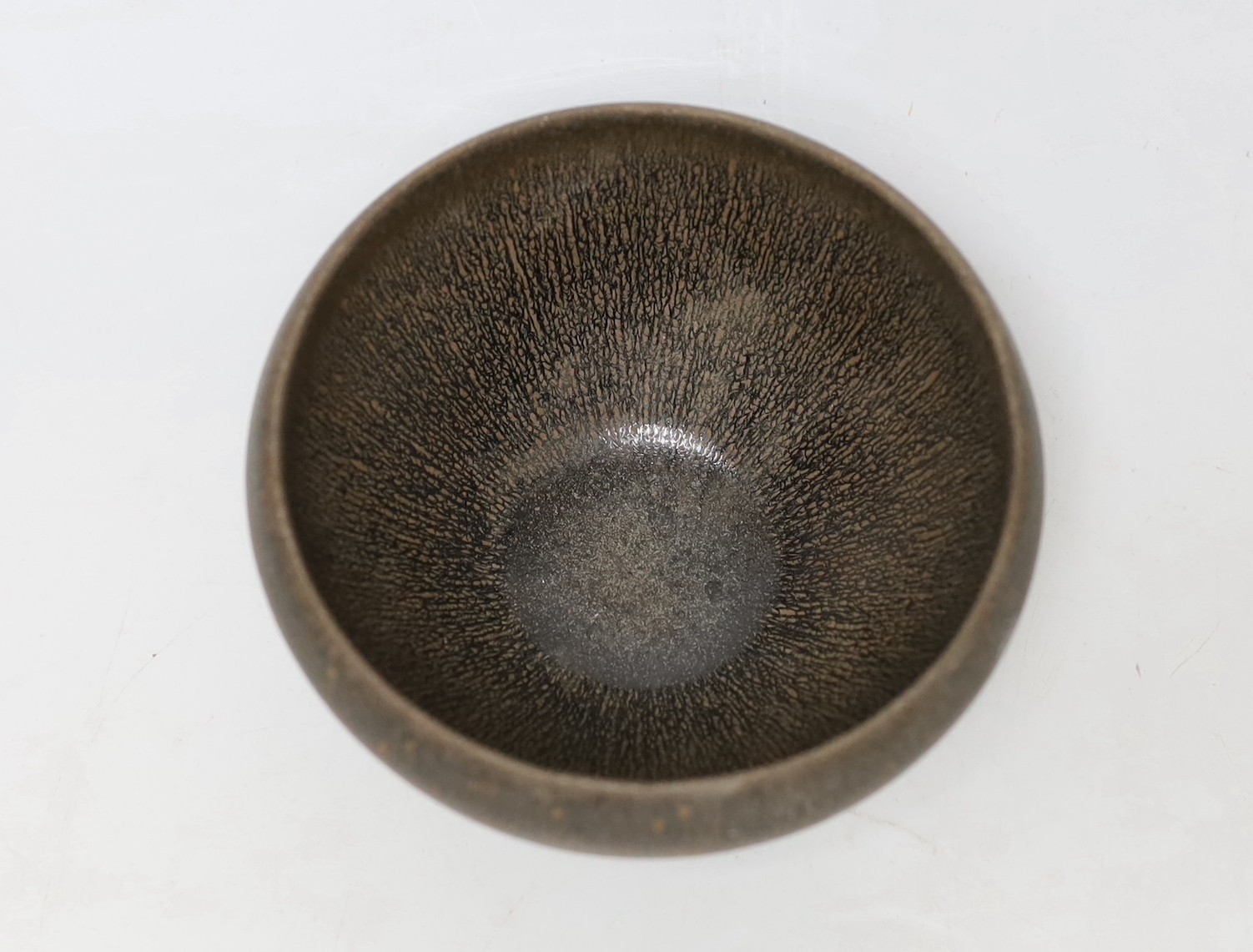 A Chinese brown pottery bowl, 11.5cms diameter